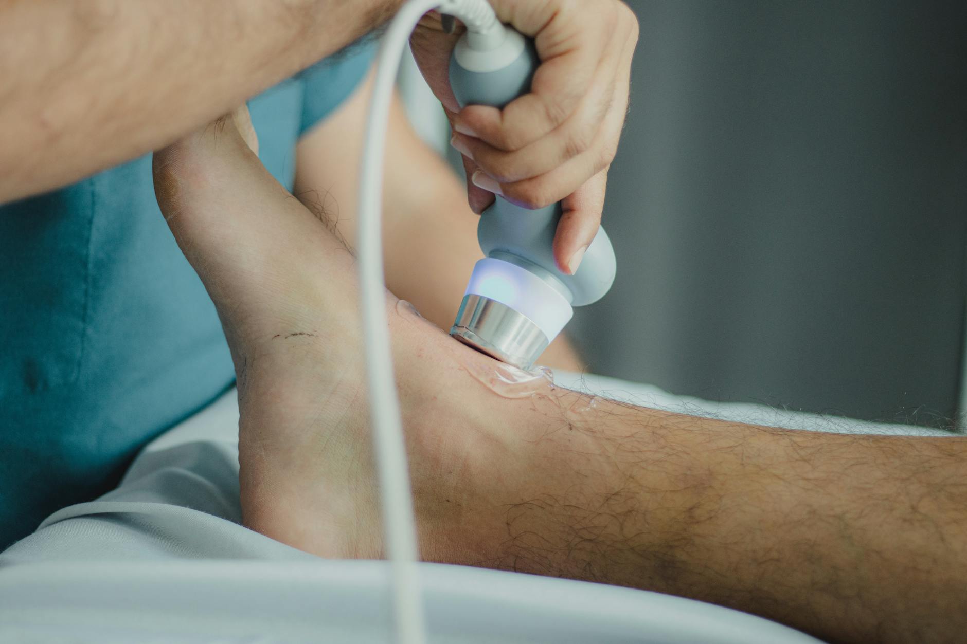 Close-up of a patient's leg during a vascular examination.