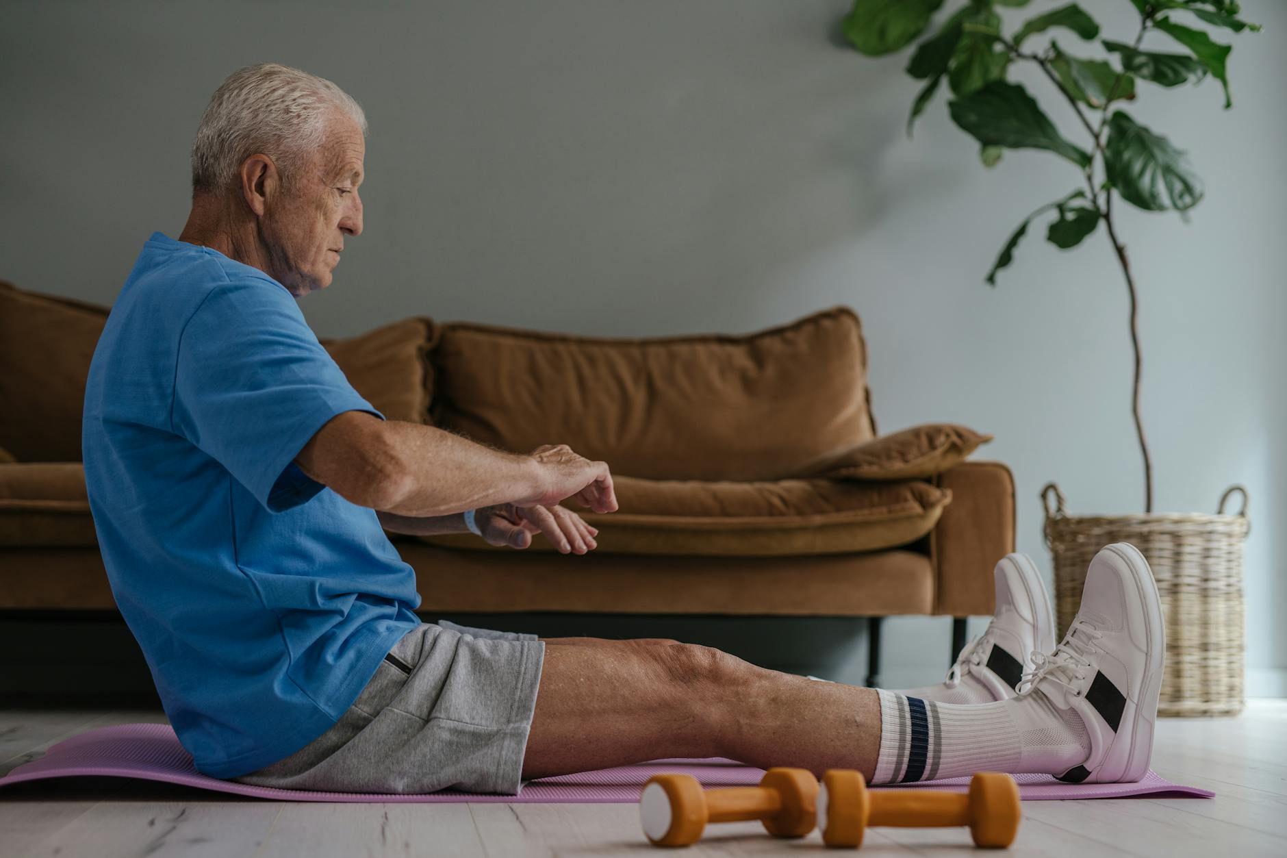 An older man stretching, representing proactive men's health.